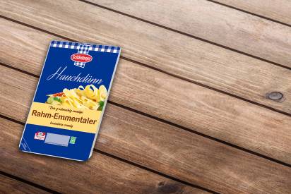 Das Bild zeigt den Rahm-Emmentaler besonders würzig in hauchdünnen Scheiben